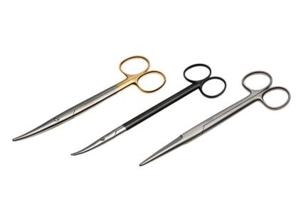 Three professional stainless steel surgical scissors with gold, black, and silver handles on a white background